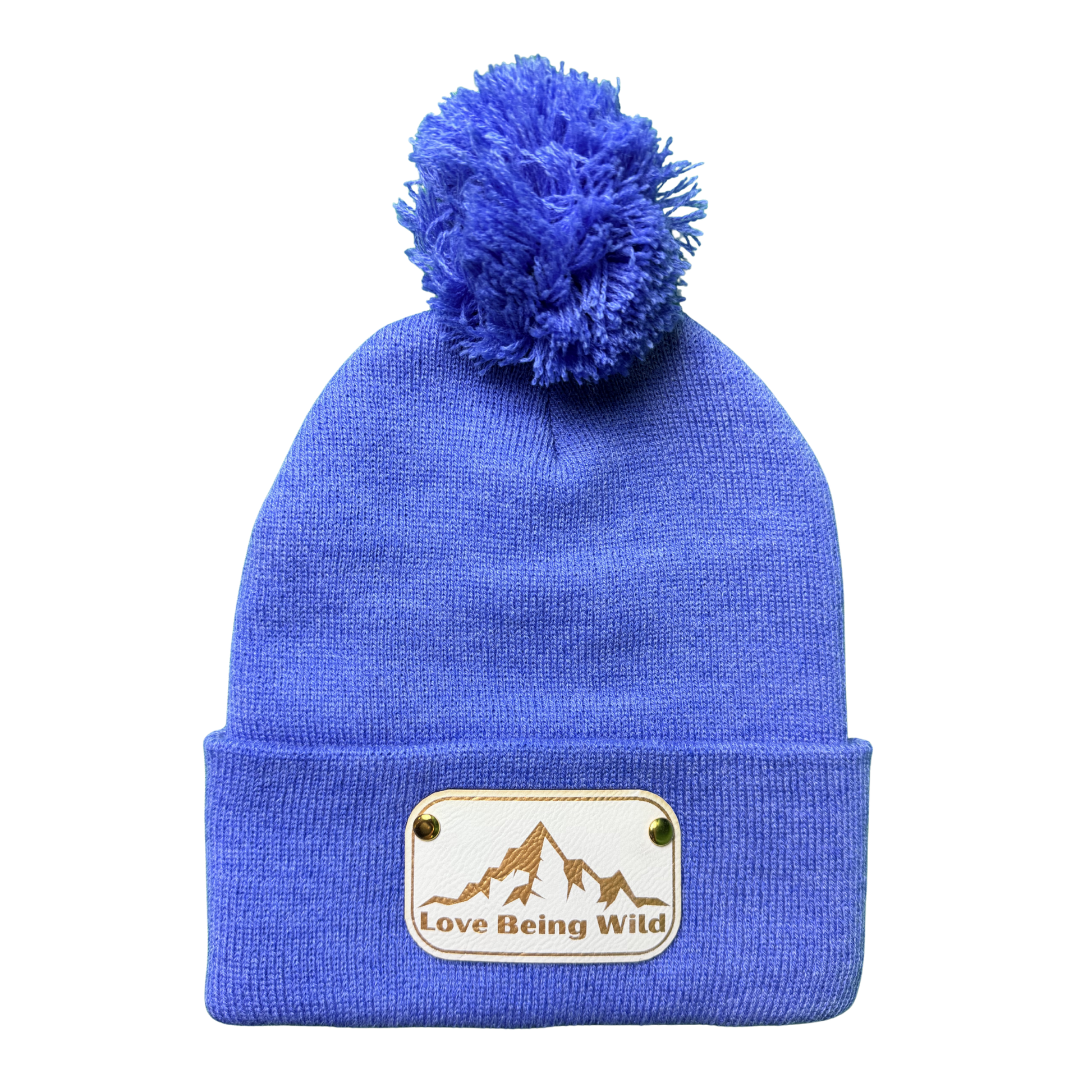 Blue beanie with pom-pom and 'Love Being Wild' patch on a white background