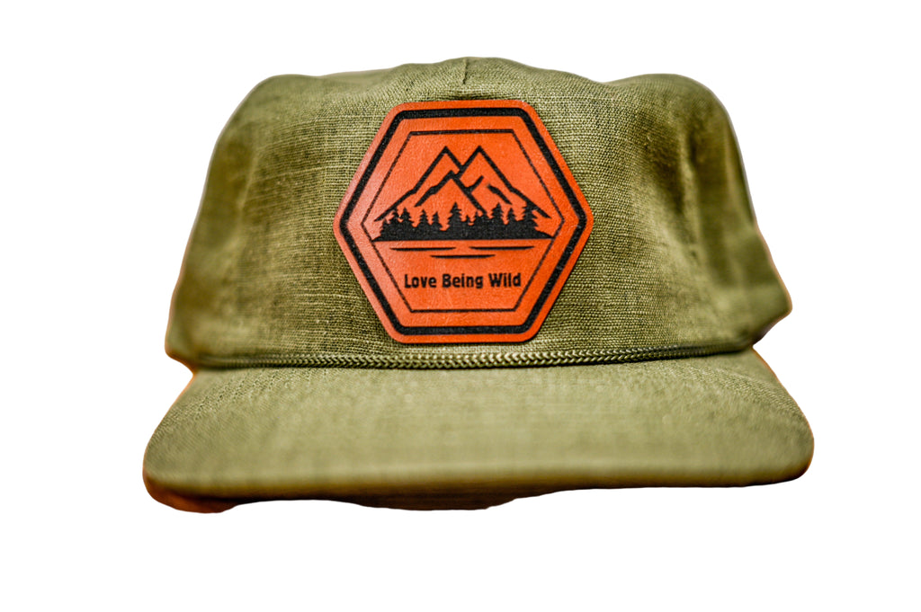 Green cap with an orange and leatherette  patch 
