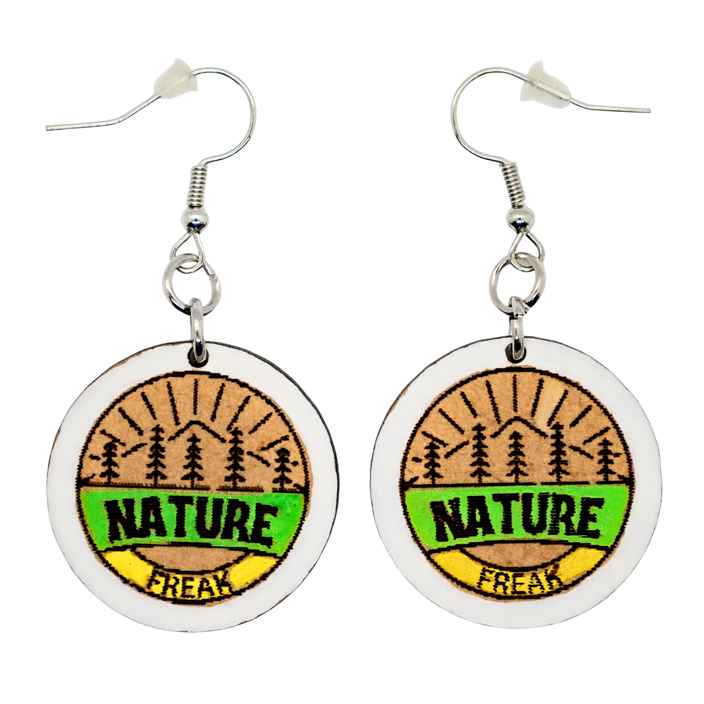 Nature Freak badge earrings with pines and mountains