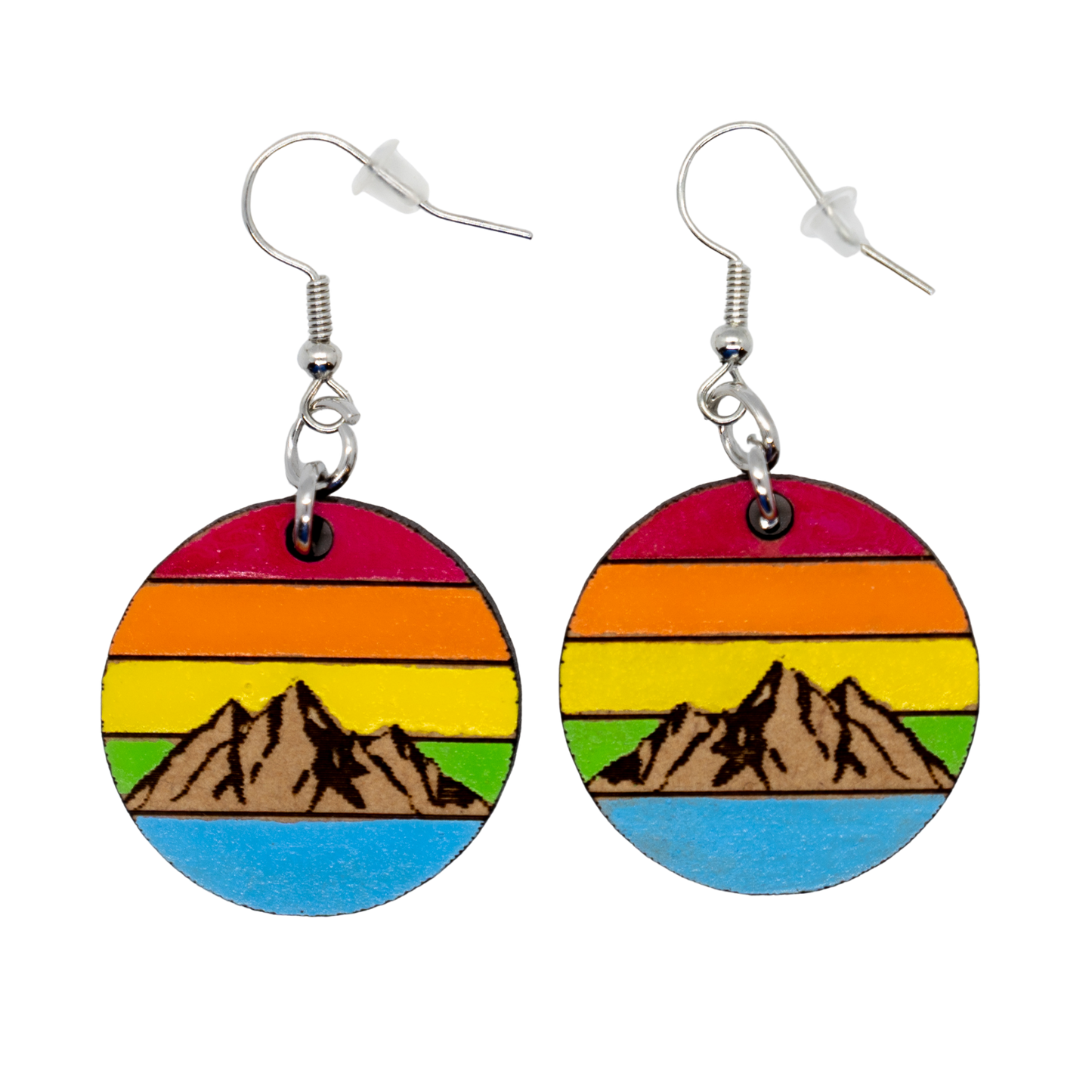Colorful round earrings with mountain design on a white background