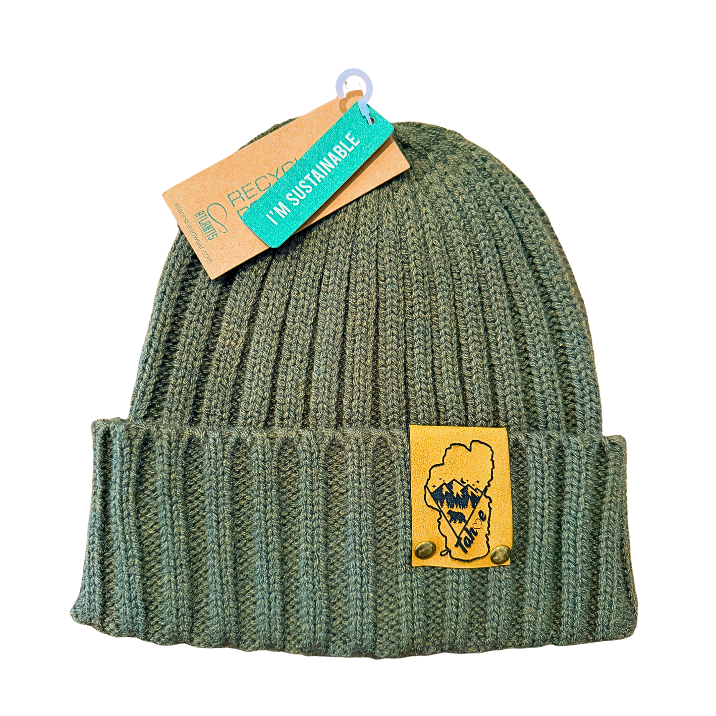 Green knit beanie with a patch and a sustainability tag on a white background