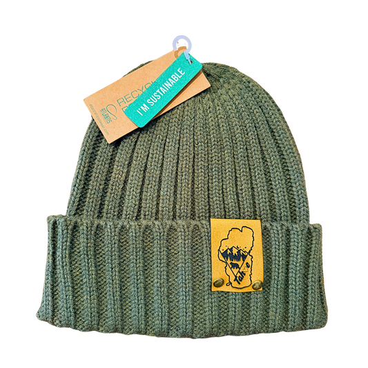 Green knit beanie with a patch and a sustainability tag on a white background